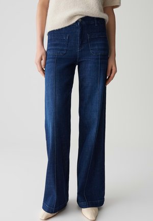 Dark blue wide-leg jeans made of denim, featuring front and back pockets, contrasting stitching, and a smooth texture.