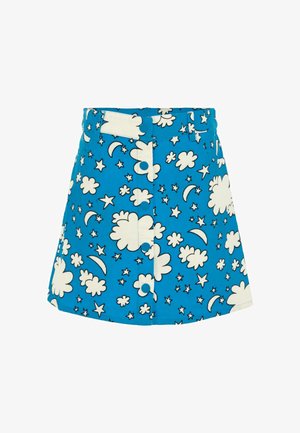 Jupe en velours côtelé bleu avec des motifs de nuages blancs, d'étoiles et de lune croissante. Équipée d'une fermeture à bouton et de passants de ceinture.
