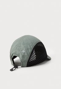 Light green running cap with a textured surface, mesh sides, and a small mountain logo. Features an adjustable drawstring for fit.