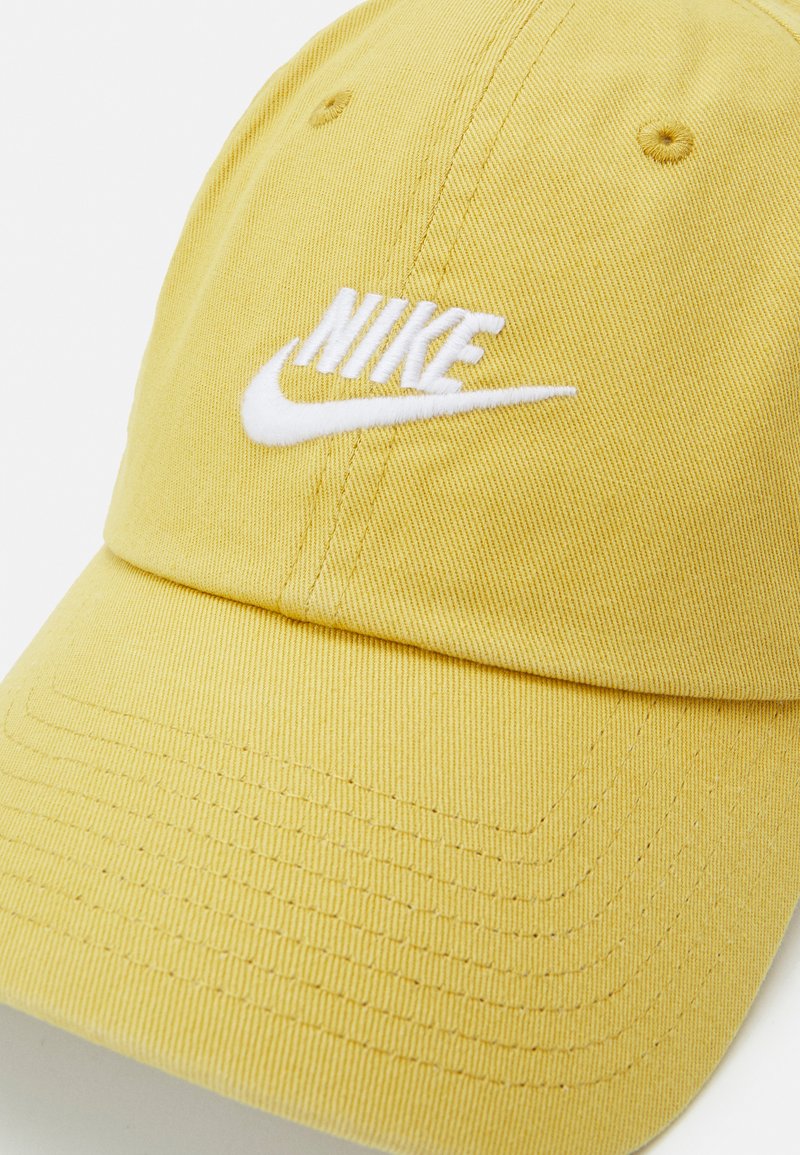white and gold nike hat