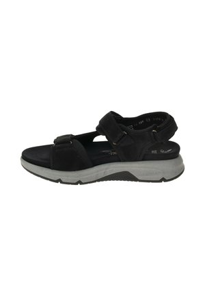 Sandalia negra de punta abierta con correas ajustables de velcro y suela gruesa acolchada en gris, diseñada para la comodidad y el uso casual.