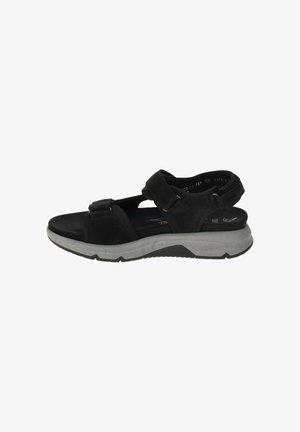 Sandal nera aperta con dita, con fasce regolabili in Velcro e suola spessa e grigia ammortizzata, progettata per il comfort e l'uso casual.
