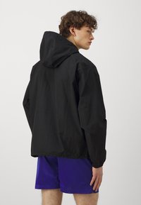 Nike Performance NBA BROOKLYN NETS ANORAK - Vereinsmannschaften - black/white