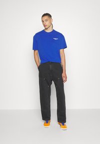 Carhartt WIP NASH PANT SMITH - Relaxed fit jeans - black stone washed