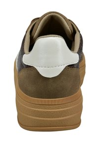 Brown suede sneaker with a white leather heel tab, padded collar, and textured fabric. Rubber sole with horizontal grooves for traction.