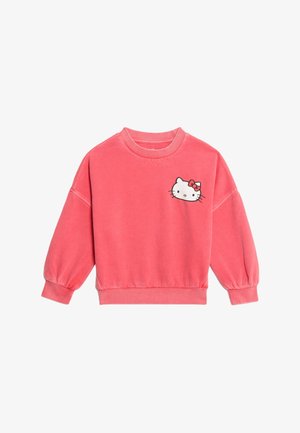 Korallenrosa Sweatshirt mit langen, puffigen Ärmeln. Mit einem grafischen Motiv eines Cartoons mit einer Schleife auf der linken Vorderseite. Weicher Stoff.
