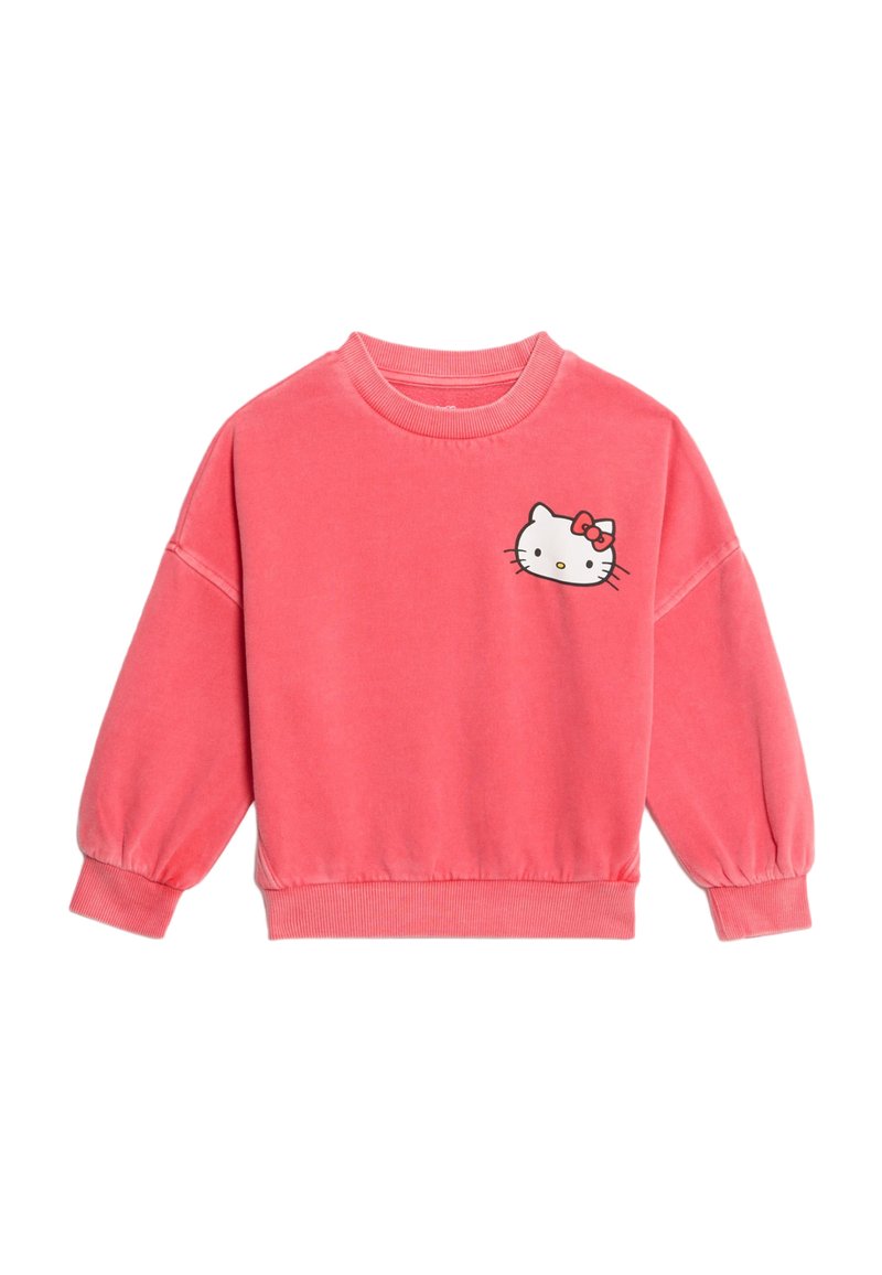 Sudadera de color coral con mangas largas y abullonadas. Presenta un gráfico en la parte frontal izquierda del pecho de un personaje de dibujos animados con un lazo. Textura de tela suave.