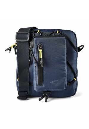 Kompaktowa granatowa torba na ramię z regulowanym paskiem, przednią kieszenią na zamek oraz jasnopomarańczowymi suwakiem i elastycznymi sznurkami.