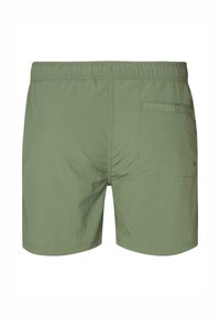 Pantaloni da bagno verdi realizzati in materiale leggero. Presentano una vita elasticizzata, una tasca sul retro e una texture liscia.