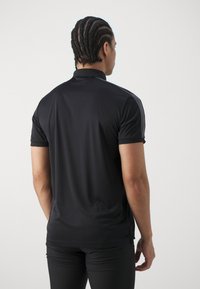 Peak Performance PLAYER - Poloshirts - black/motion grey