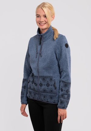 Blue zip-up jacket made of textured fabric with dark patterned accents along the lower hem and sleeves, featuring a high collar and adjustable drawstrings.