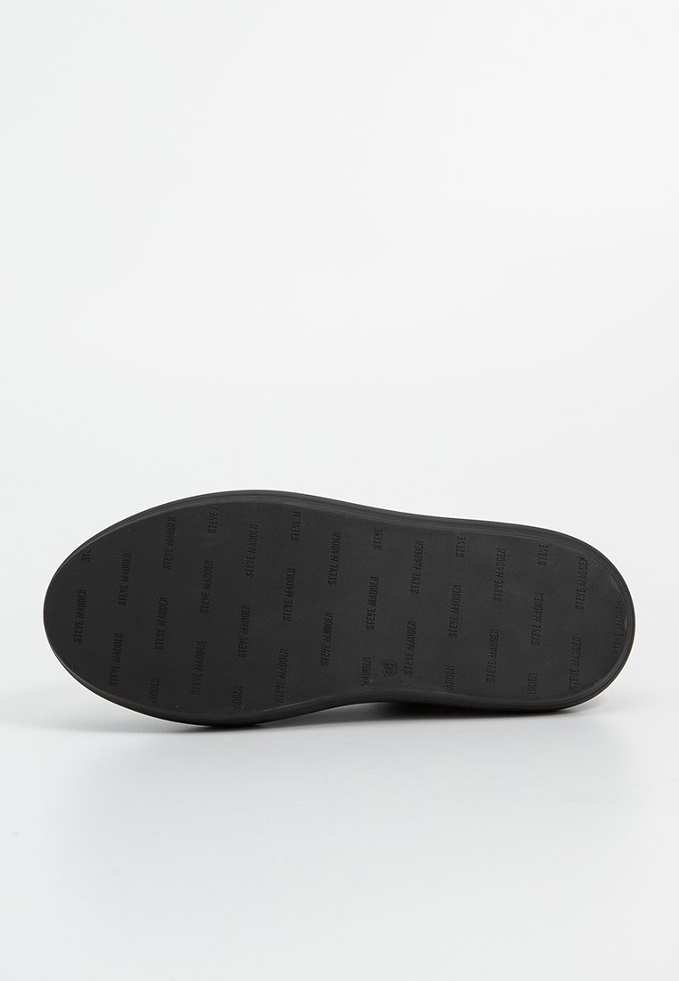 Suola di scarpe nera in gomma con motivi a rilievo del marchio, texture liscia, bordi arrotondati e leggera curvatura nella zona delle dita.
