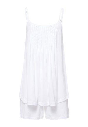 Weißes ärmelloses Oberteil mit plissierter Vorderseite und verstellbaren Trägern. Kombiniert mit passenden weißen Shorts. Aus weichem Baumwollmaterial.
