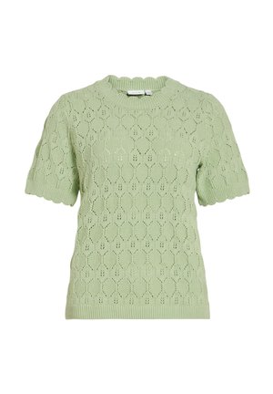 Pull en maille vert clair à manches courtes avec bords festonnés et motif ajouré en forme de feuilles.