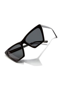 Black angular sunglasses with grey lenses. Thick frames feature sharp edges and a glossy finish. Arms extend slenderly from the main body.