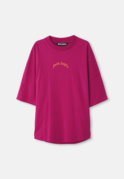 Fuchsia oversized t-shirt van katoen, met korte mouwen en een ronde hals. "Palm Angels" logo geborduurd in goud.