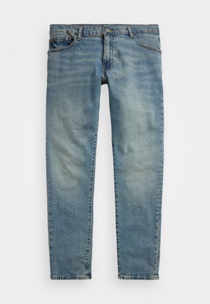 Lys blå denimjeans med rett snitt, med fem lommer, knapp- og glidelås-lukking, og synlig falming langs lårene.