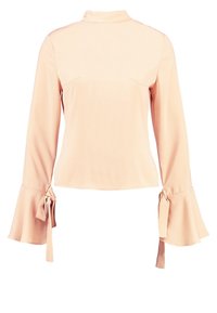 Blusa rosa chiaro con maniche lunghe a campana, caratterizzata da dettagli annodati nei polsini e un collo alto. Texture liscia e cuciture minime.
