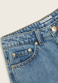 Denim jeans in light blue, featuring a straight cut, copper-tone hardware, and visible stitching on pockets and waistband. Label reads "made with recycled materials."