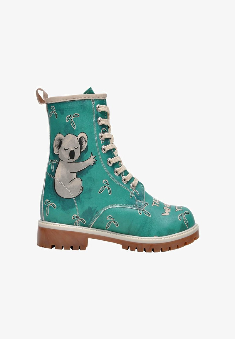 Teal leather ankle boot with a beige sole, featuring a koala graphic and leaf patterns. Sturdy lace-up design with metal eyelets.