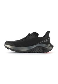 Scarpa da ginnastica nera con upper in knit traspirante, punta rinforzata e suola imbottita e testurizzata per aderenza e supporto.