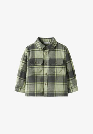 Roheline ja hall ruuduline triiksärk pikkade varrukatega, kraega kaelusega, kahe rinnatasku ja nööpidega. Pehme kangast tekstuur, vabaaja disain.