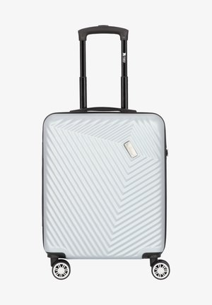 Valise rigide de couleur gris clair avec un motif en chevrons, poignée noire rétractable et quatre roues pivotantes pour une mobilité aisée.
