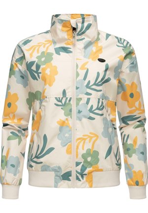 Veste beige clair zippée avec motifs floraux verts, jaunes et bleus, poignets élastiques et ceinture côtelée.