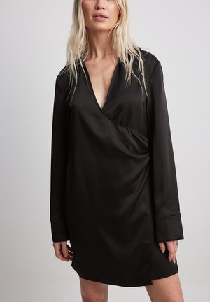 Black satin wrap dress with long sleeves, a deep V-neck, side slit, and smooth texture, featuring a simple, streamlined design.