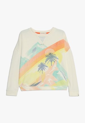 Kremowa bluza z nadrukiem kolorowego, błyszczącego krajobrazu z górami, słońcem i palmami. Prążkowany dekolt i mankiety.