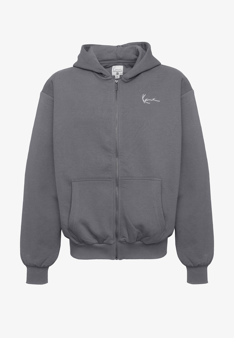 Sötétszürke cipzáras kapucnis pulóver első zsebekkel, elasztikus mandzsettákkal és szegéllyel, kapucnival és kis fehér színű feliratos logóval a bal mellrészen.