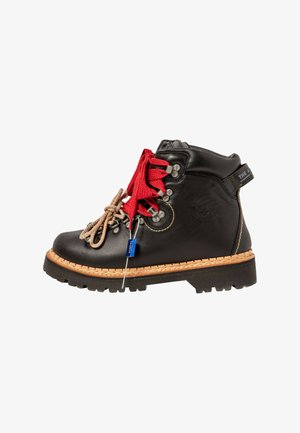 Black leather hiking boot with red and beige laces, metal eyelets, and thick rubber sole. Features a stitched tan midsole and logo patch.