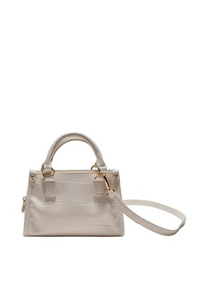Petit sac à main en cuir beige avec poignées supérieures et bandoulière détachable, équipé de ferrures dorées et d'une forme rectangulaire structurée.