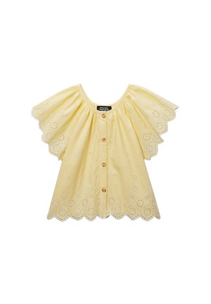 Blouse jaune à manches courtes avec bords festonnés, broderie œillet florale et boutons devant, avec une coupe ample et fluide.