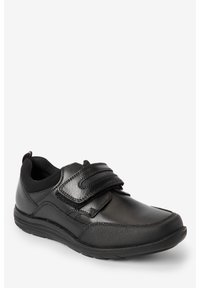 Chaussures de sport noires en matériau synthétique, arborant une texture lisse, un système de fermeture avec bande Velcro, et un col rembourré pour plus de confort.