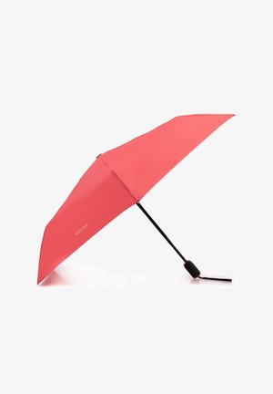 Coral umbrella with a sleek, curved shape. Black metal frame and handle, featuring a strap for easy carrying. Brand name in gold lettering.