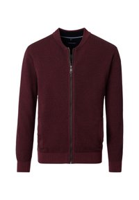 Burgundy zip-up tröja med strukturerad tyg, ribbade ärmslut och två sidofickor. Enkelt mönster med rund halsringning och inga mönster.