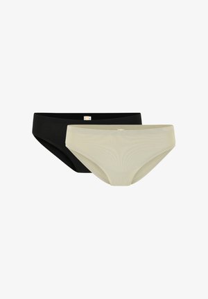 Culottes noires et vert clair sans couture, présentant une texture lisse et un design simple. Chacune a une petite étiquette au niveau de la taille.