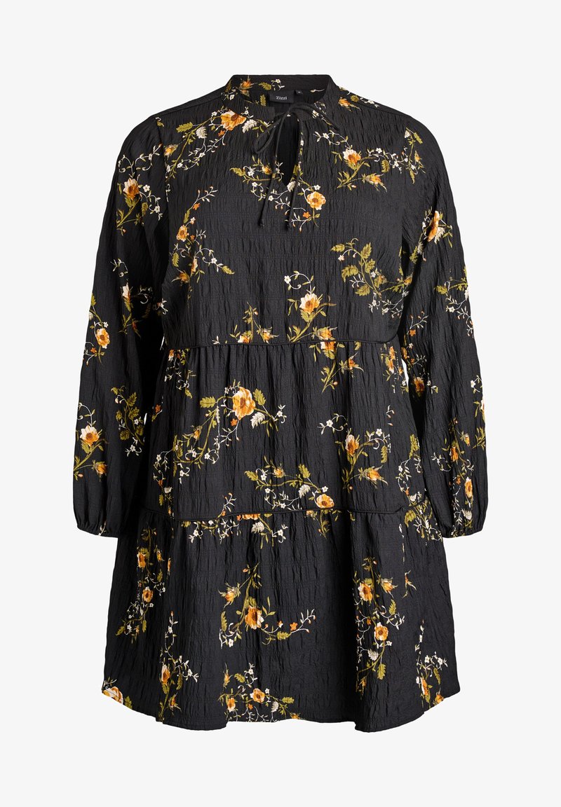 Črna, večstopenjska obleka z dolgimi rokavi, ki ima cvetlični vzorec v oranžni in beli barvi. Narejena je iz strukturirane tkanine z detajlom zavezovanja pri vratu.