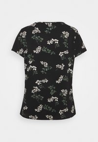 Black short-sleeve top featuring white floral print and green leaves. Smooth texture with a slight round hem at the bottom.