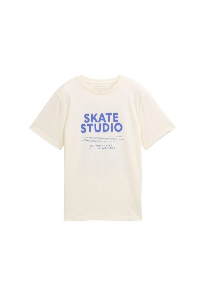 Kreminės spalvos medvilninė marškinė su ryškiais mėlynais užrašais "SKATE STUDIO" ir papildomu tekstu apačioje. Trumpomis rankovėmis ir apvaliu iškirpimu.