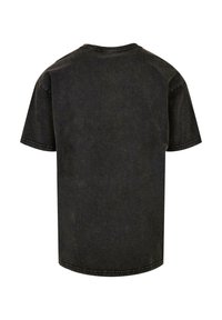 Sort bomuld t-shirt med korte ærmer og rund halsudskæring. Casual design, subtil tekstur og synlig syning langs kanten og ærmerne.