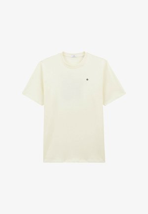 T-shirt en coton couleur crème avec des manches courtes, un col rond et un petit logo circulaire sur le côté gauche de la poitrine. Texture lisse.
