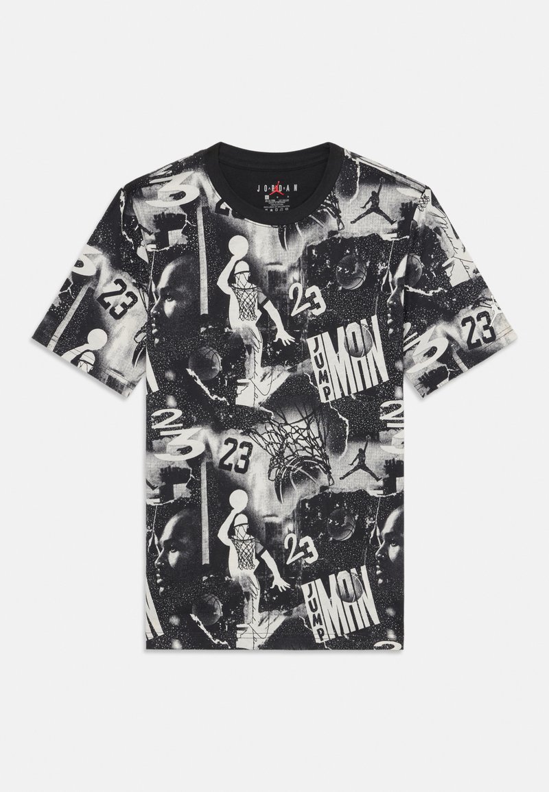 Black and white graphic t-shirt featuring various basketball-related images, patterns, and the number "23" throughout the design.