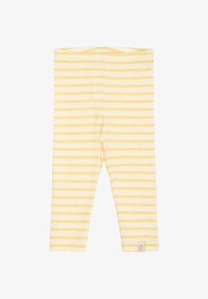 Leggings a rayas amarillas y crema, confeccioandos en una tela suave y elástica, con una cinturilla elástica y una pequeña etiqueta en el dobladillo.