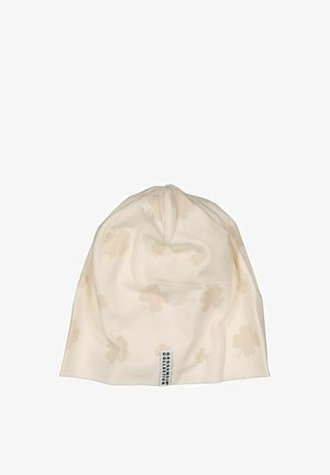 Cream knitted beanie hat with a soft texture, featuring an all-over light floral pattern. Includes a stitched tag on the side.