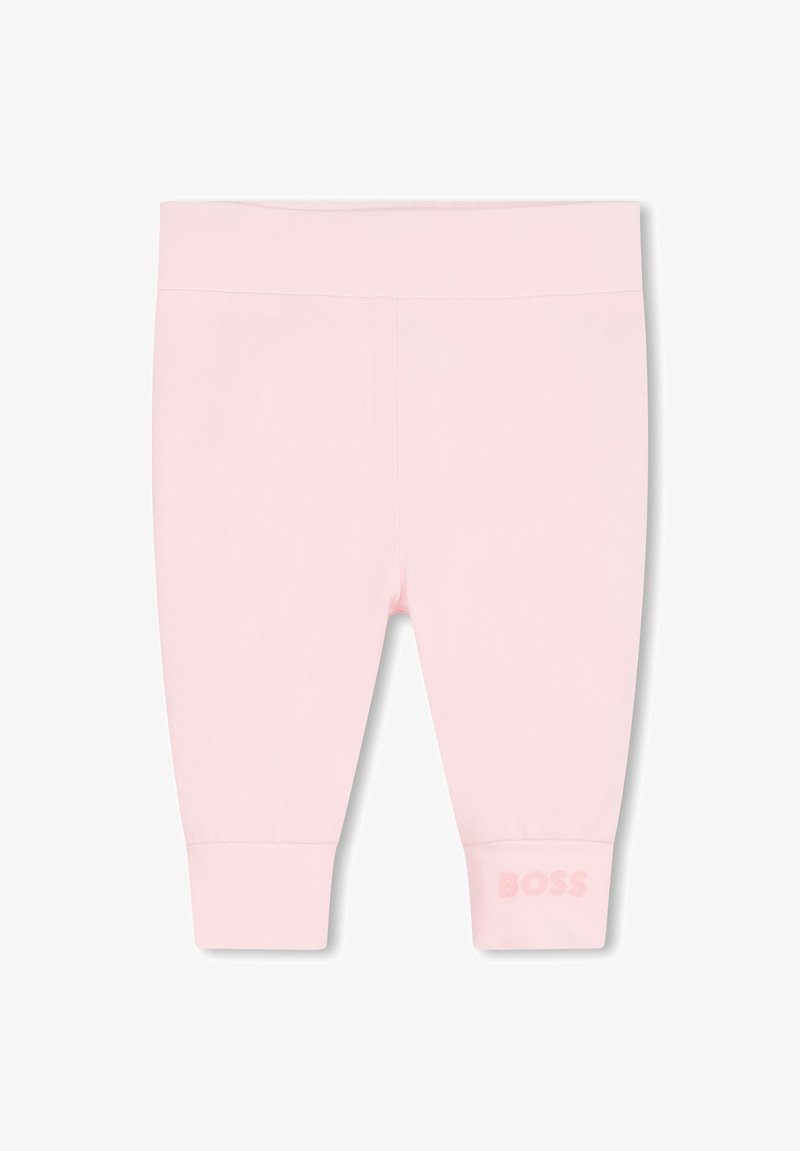 Leggings roses en coton doux, présentant un design simple avec une taille côtelée et le logo "BOSS" embossé sur l'ourlet gauche.