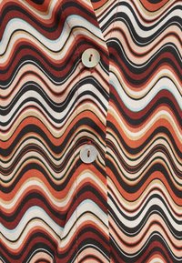 Unselected, rust multi wave print