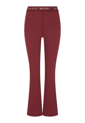 Sportovní legíny se zvonovými nohavicemi v tmavě vínové barvě, vyrobené z elastické látky. Disponují jednobarevným provedením a potištěným pasem s nápisem "BAKER SPORT".