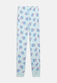 Calças de pijama justas de cor azul claro com estampagens repetidas de personagens de cartoon em azul e rosa.